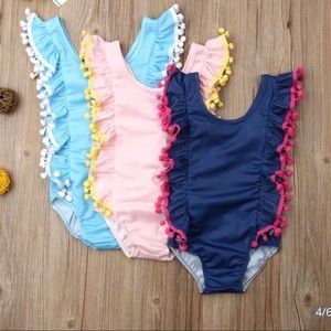 Toddlers to girls ruffled Pom Pom  swimsuits.